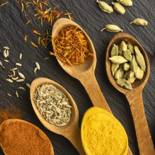 top-view-indian-spices-with-wooden-spoons